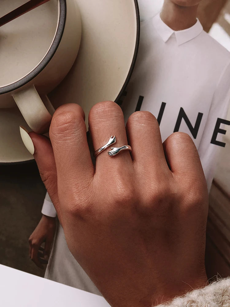 The Hug Ring — 925 sterling silver adjustable ring with two hugging hands (7)