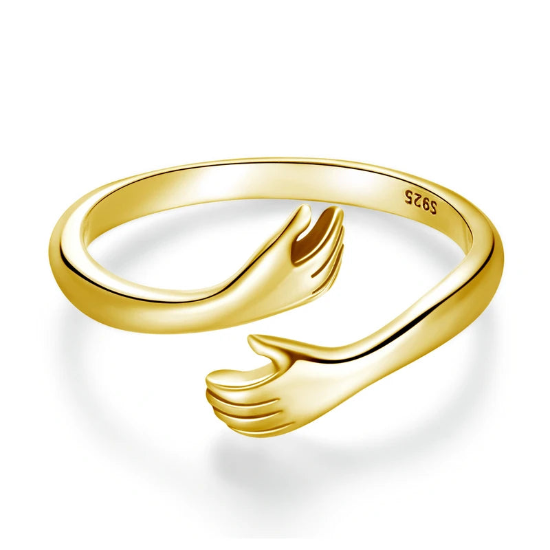 The Hug Ring in Gold — 925 sterling silver adjustable ring with two hugging hands