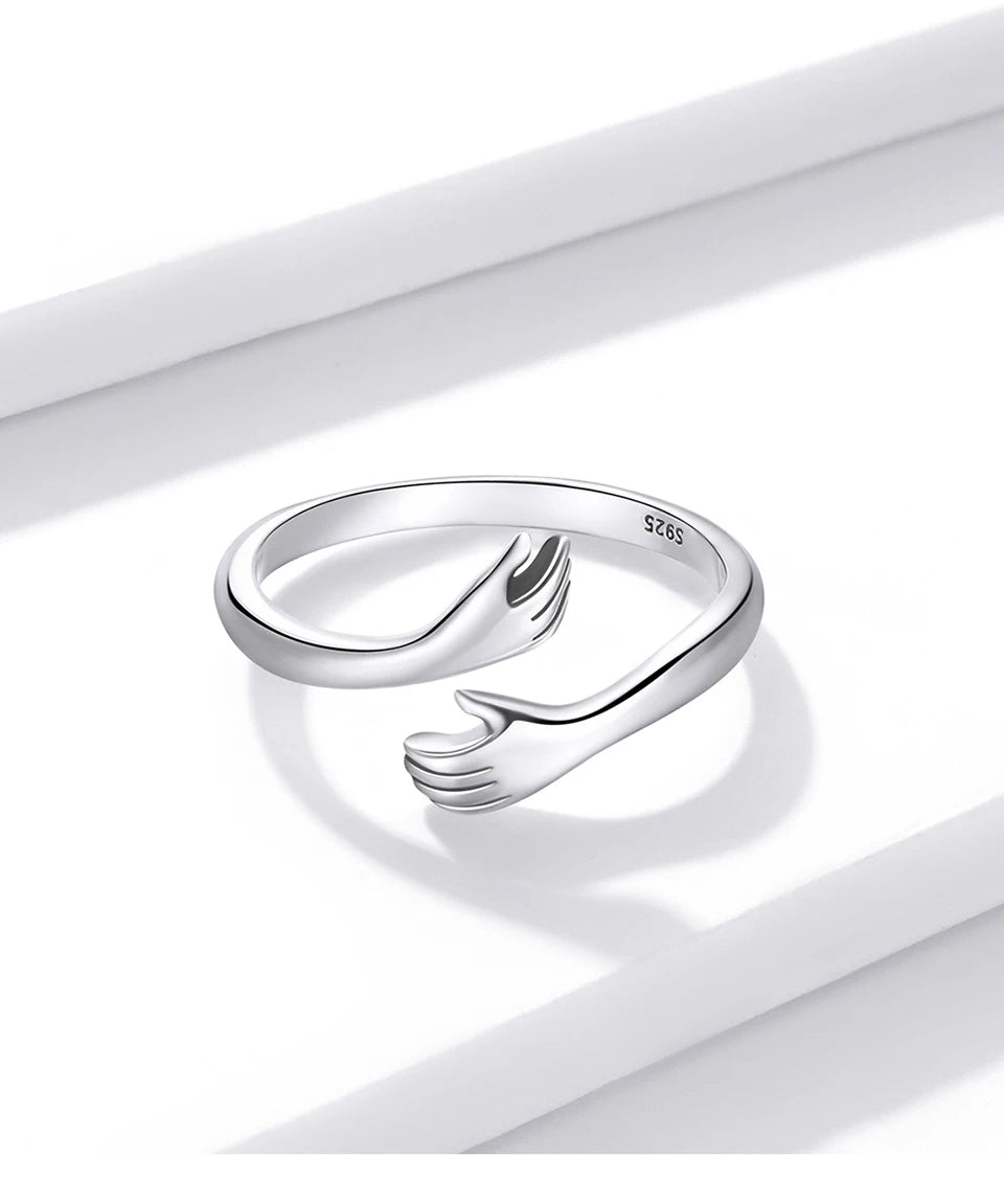 The Hug Ring — 925 sterling silver adjustable ring with two hugging hands (1)