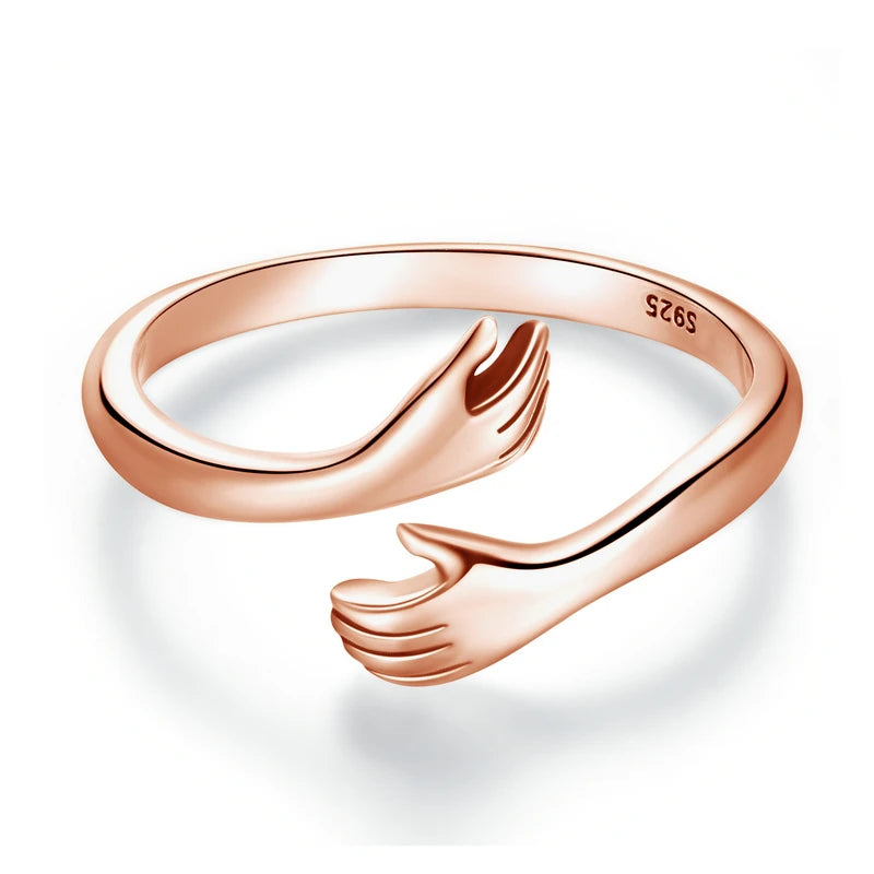 The Hug Ring in Rose Gold — 925 sterling silver adjustable ring with two hugging hands