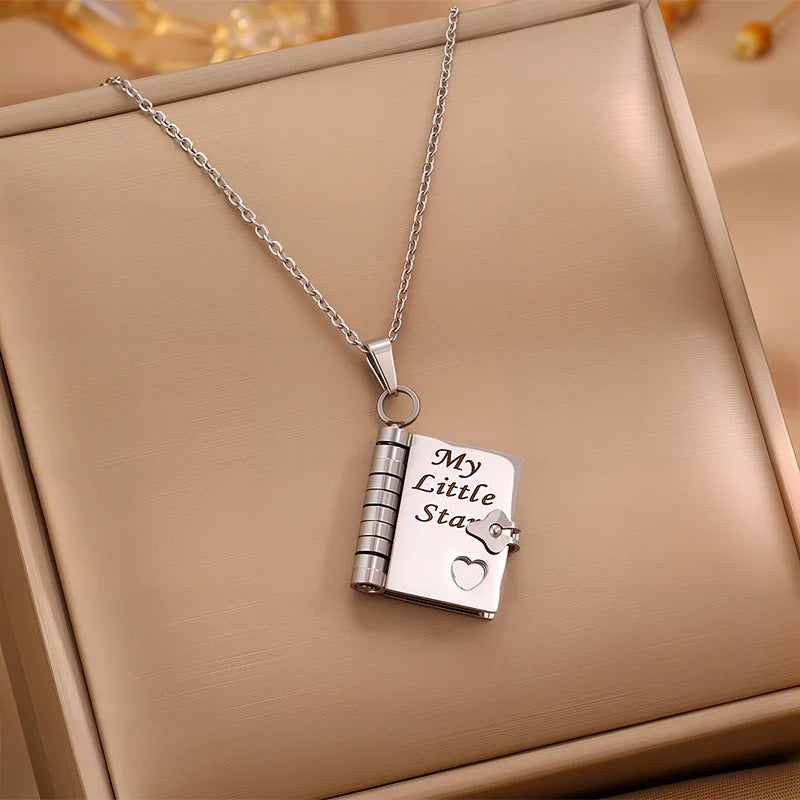 My Little Star openable book necklace in Silver — for daughter with 6 engraved pages
