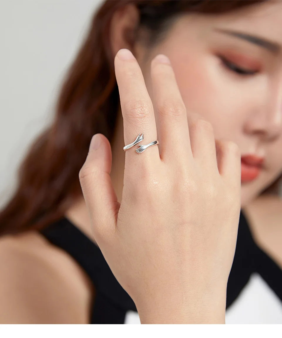 The Hug Ring — 925 sterling silver adjustable ring with two hugging hands (10)