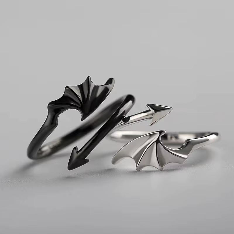 Matching black and silver devil wing and tail couple rings