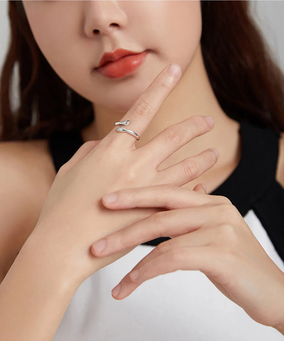 The Hug Ring — 925 sterling silver adjustable ring with two hugging hands (8)