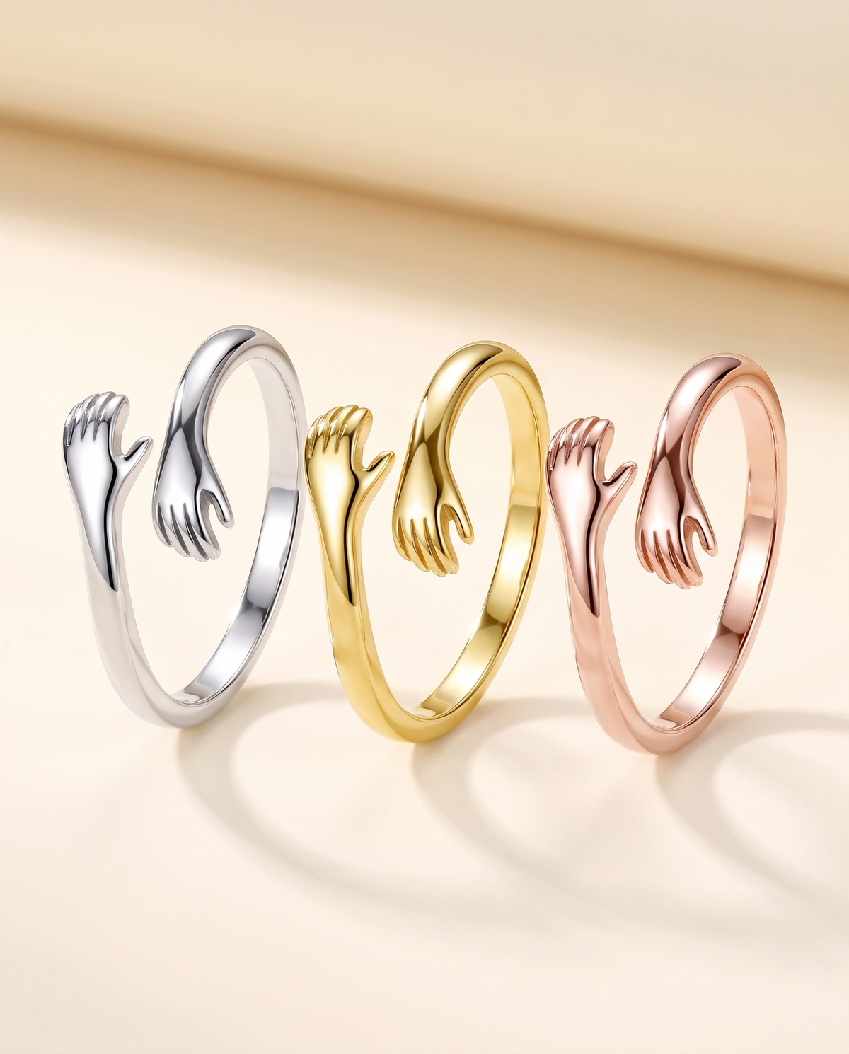 The Hug Ring in silver, gold and rose gold