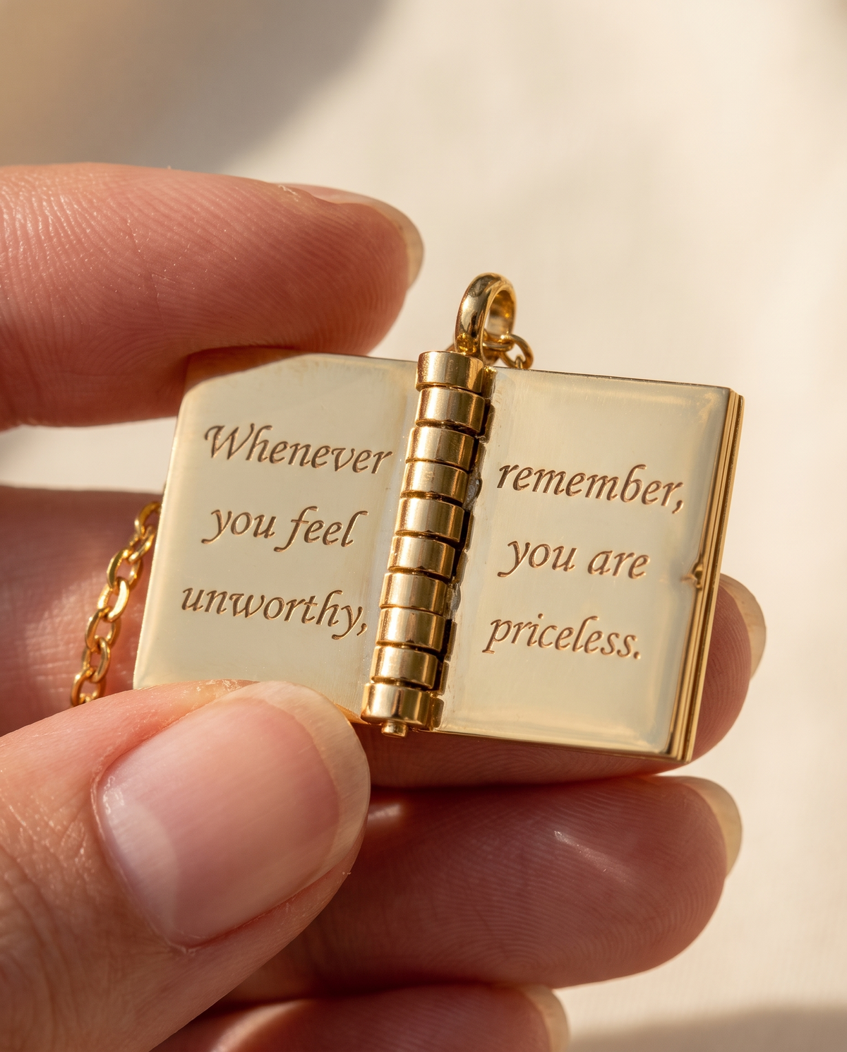 My Little Star book pendant open to an engraved page: Whenever you feel unworthy, remember, you are priceless
